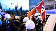 Police confiscated swastika flags at a Neo-Nazi march.