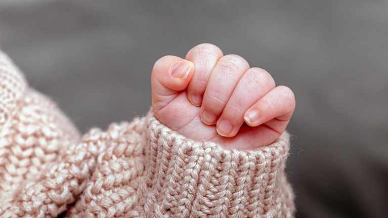 A baby's small hand.