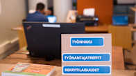 Photos shows a meeting between a jobseeker and a prospective employer at an office in Helsinki.