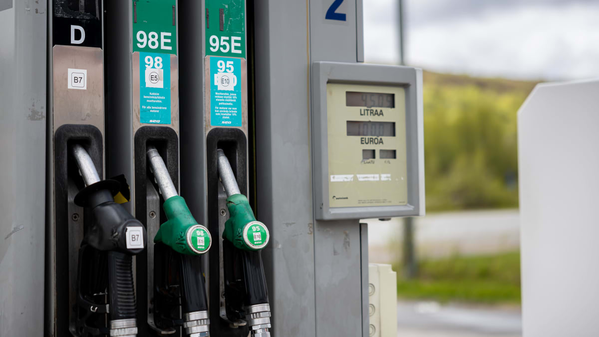 Detail of a petrol filling station in Nuorgam, Finnish Lapland, showing three fuelling pistols marked D, 98E and 95E.