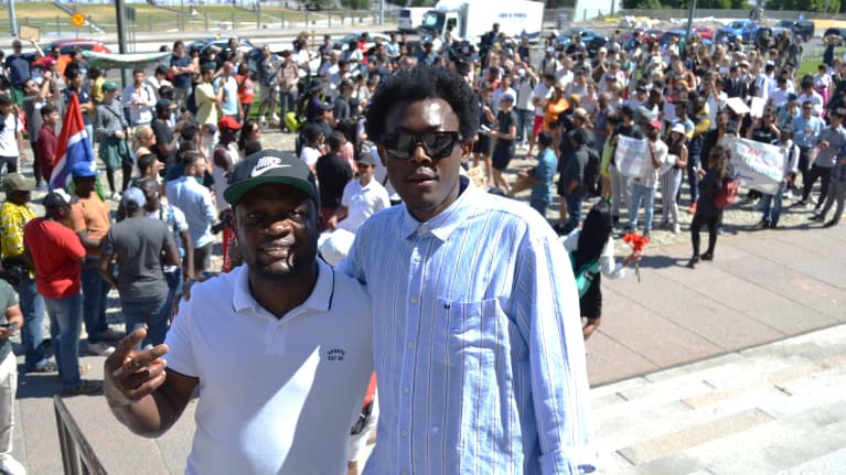 African anti-racism society Finland chairperson Ufoka Eugene and Diaspora Glitz Magazine Editor Obi West at the MASS PROTEST against the new Finnish Immigration Policy 27 June 2023 in Helsinki.