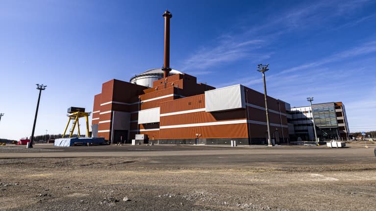 Exterior photo of Olkiluoto 3 nuclear power plant.