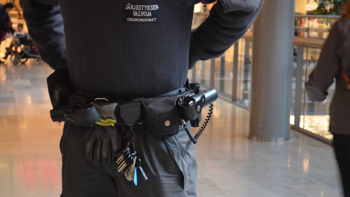 Closeup of a security guard's utility belt