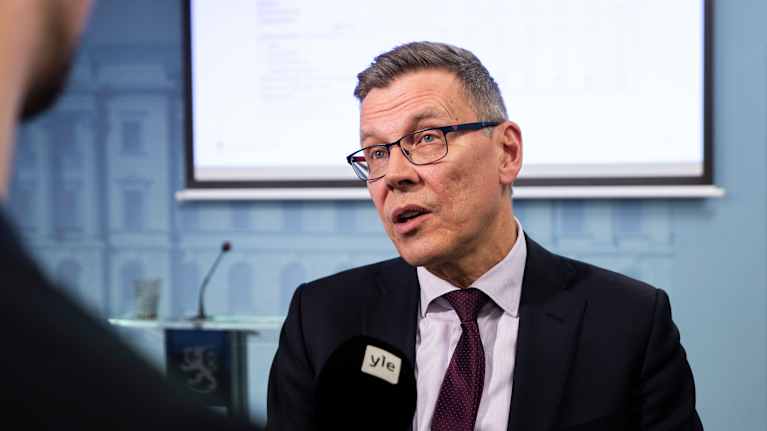 Photo shows the Finnish finance ministry's director general Mikko Spolander speaking to the media.