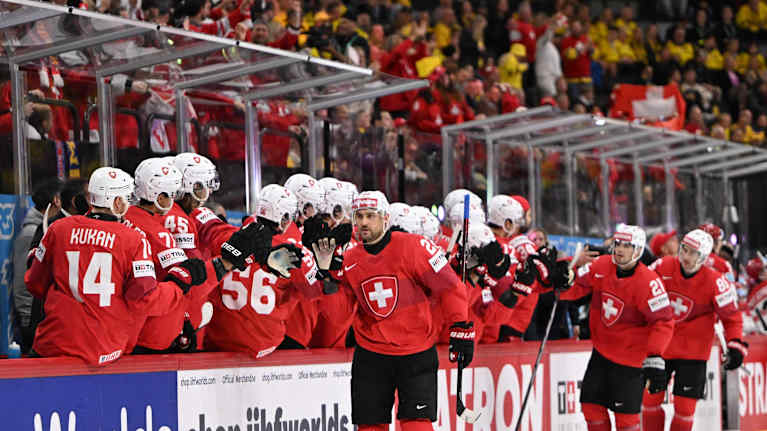 The Swiss team celebrates a goal at the World Ice Hockey Championships.
