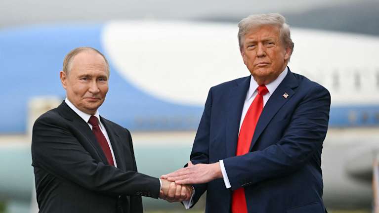Trump and Putin shook hands at a flight station in Alaska.