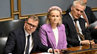 Petteri Orpo, Riikka Purra and Anders Adlercreutz sitting on the government bench at Parliament.