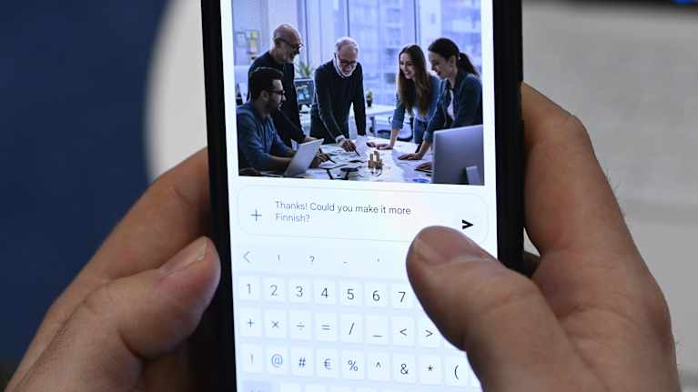 The photo shows a person using AI on a handheld device. 