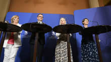 Four party leaders behind podiums at press conference. Orpo second from the left, flanked by three women.