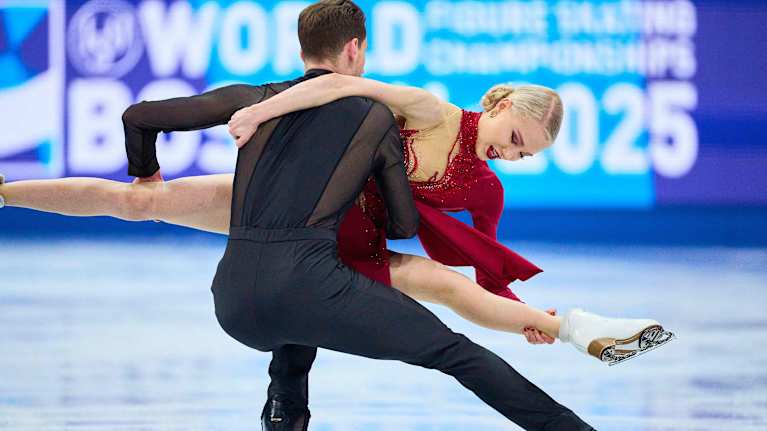 Image 2: Juulia Turkkila and Matthias Versluis perform a lift in ice dance.