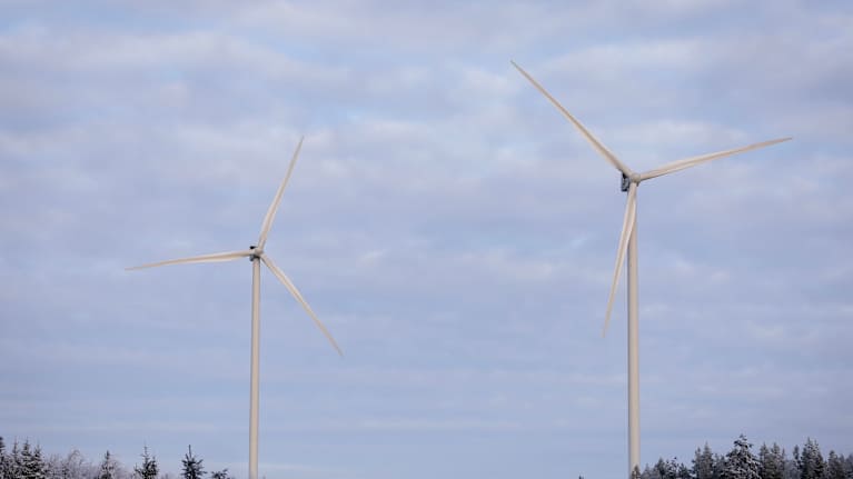 Windmills in a winter landscape.