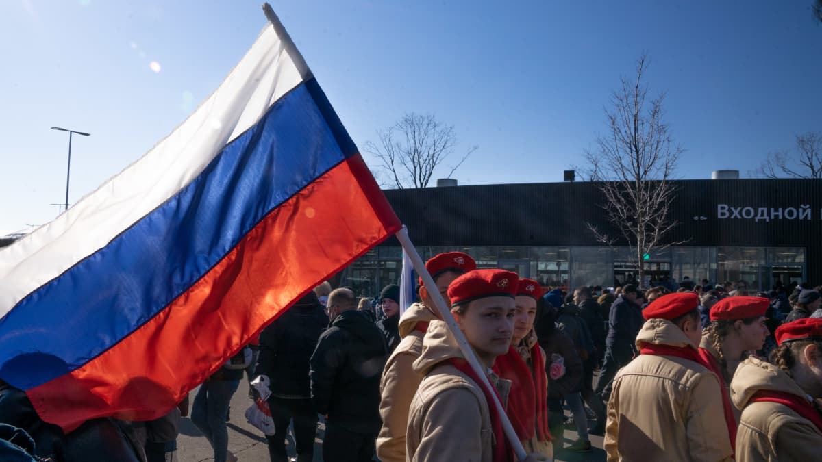 young man with Russian tricolor flag