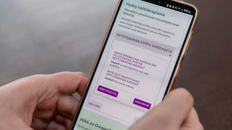 Online therapy pages on the phone screen.