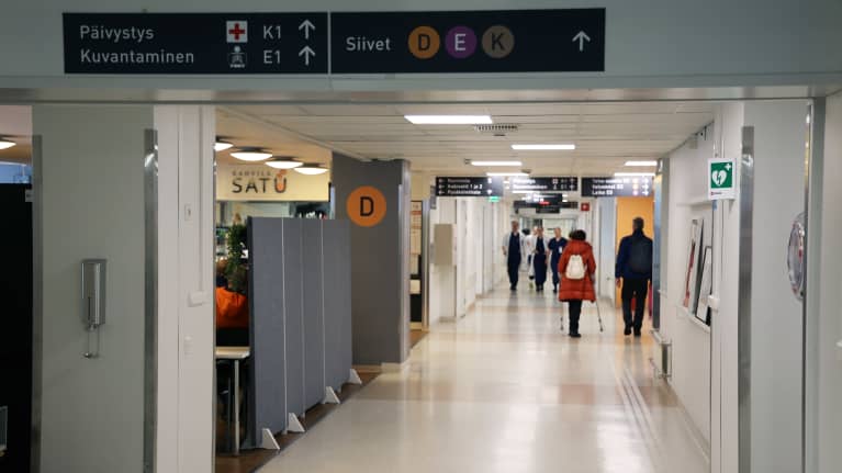 Photo shows a hospital corridor.