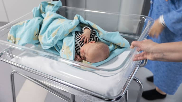 A baby in a hospital.