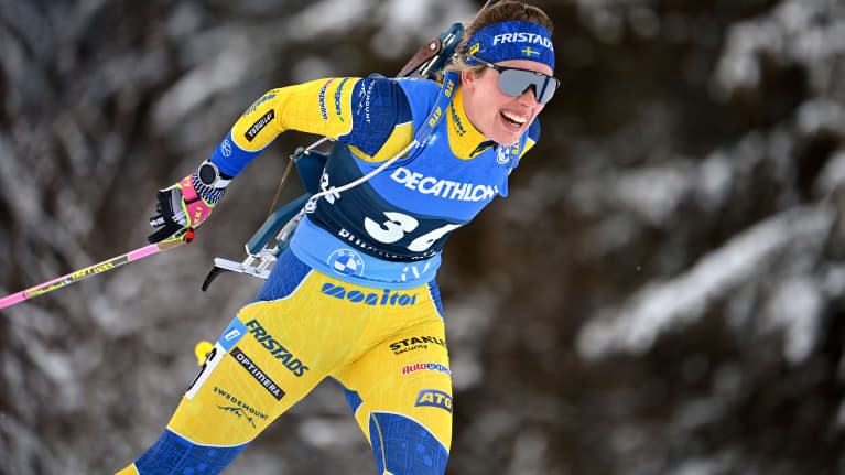 Image 13: Elvira Öberg skiing in the forest.