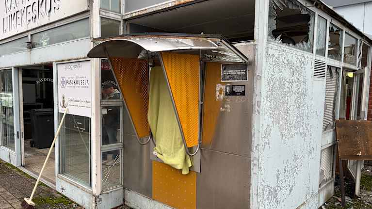 Police investigating the scene of an ATM explosion.