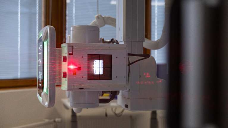 X-ray machine in a hospital imaging room.