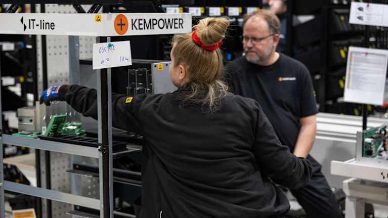 On-the-job learning training underway at the electrical equipment installation line at Kempower in Lahti.