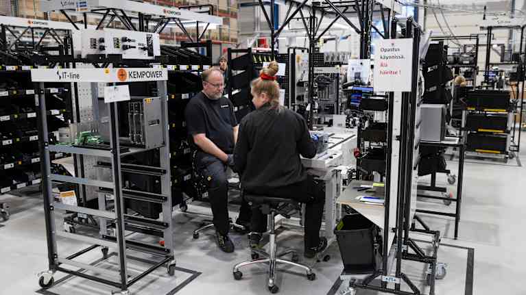 On-the-job learning training underway at the electrical equipment installation line Kempower in Lahti.