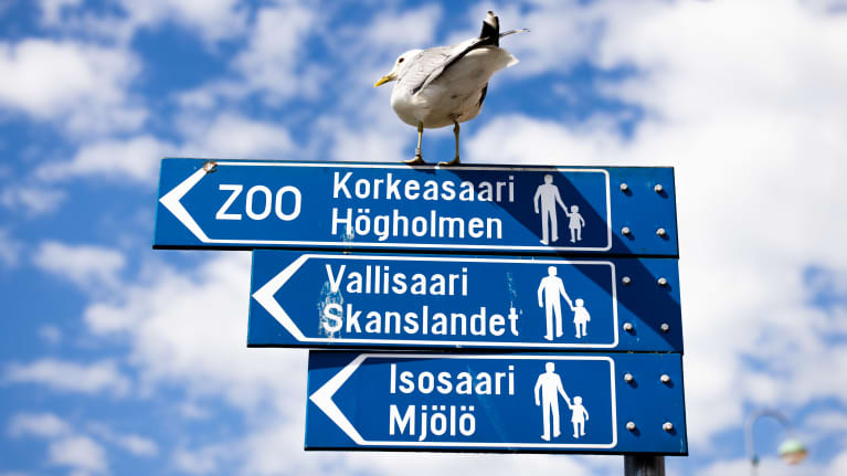 A sign for ferries to tourist destinations in Helsinki. 