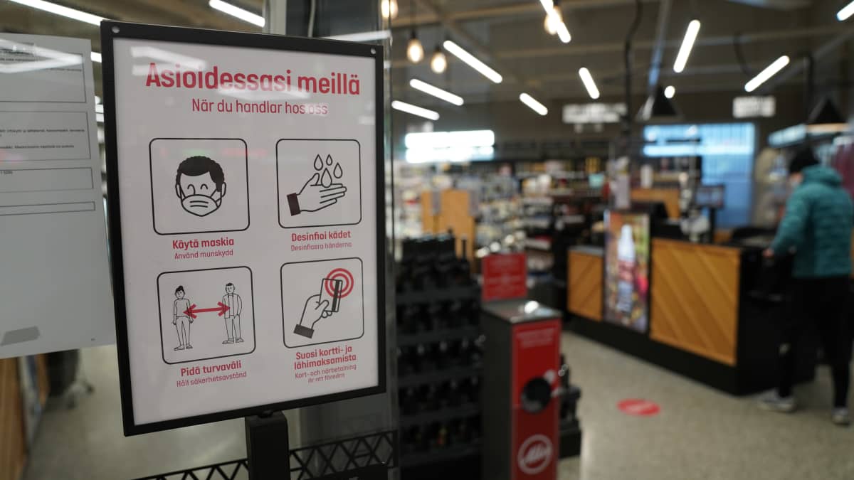 Ohjekyltti korona aikaiseen asiointiin Alkossa