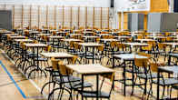 Chairs and desks fill a high school gym ahead of matriculation exams.