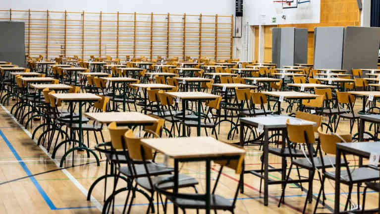 Chairs and desks fill a high school gym ahead of matriculation exams.