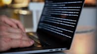 Hands typing on a laptop.
