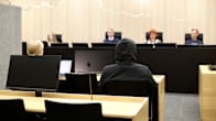Photo shows a man on trial at Oulu District Court.