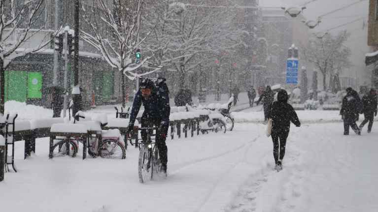 A cyclist braves the winter storm in downtown Turku.