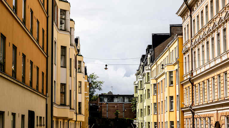 Photo shows buildings on a street in Helsinki.