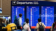 Photo shows passengers at Helsinki Airport.