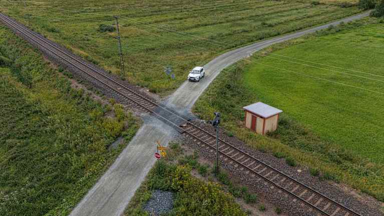 A car crossing a level crossing.
