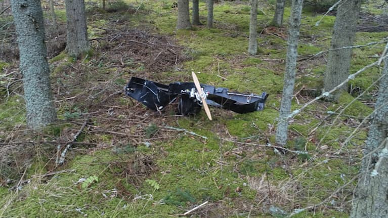 Metal debris in a forest.