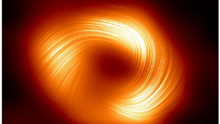 Mustan aukon ympärillä punakeltaisena kieppuvaa plasmaa.