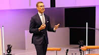 Alexander Stubb stands on stage to speak.