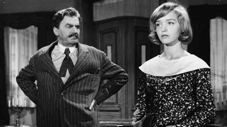 Joel Rinne with his hands in the air and Elina Salo.