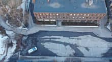 Aerial photo of Russia's Consulate General office building and parking lot.