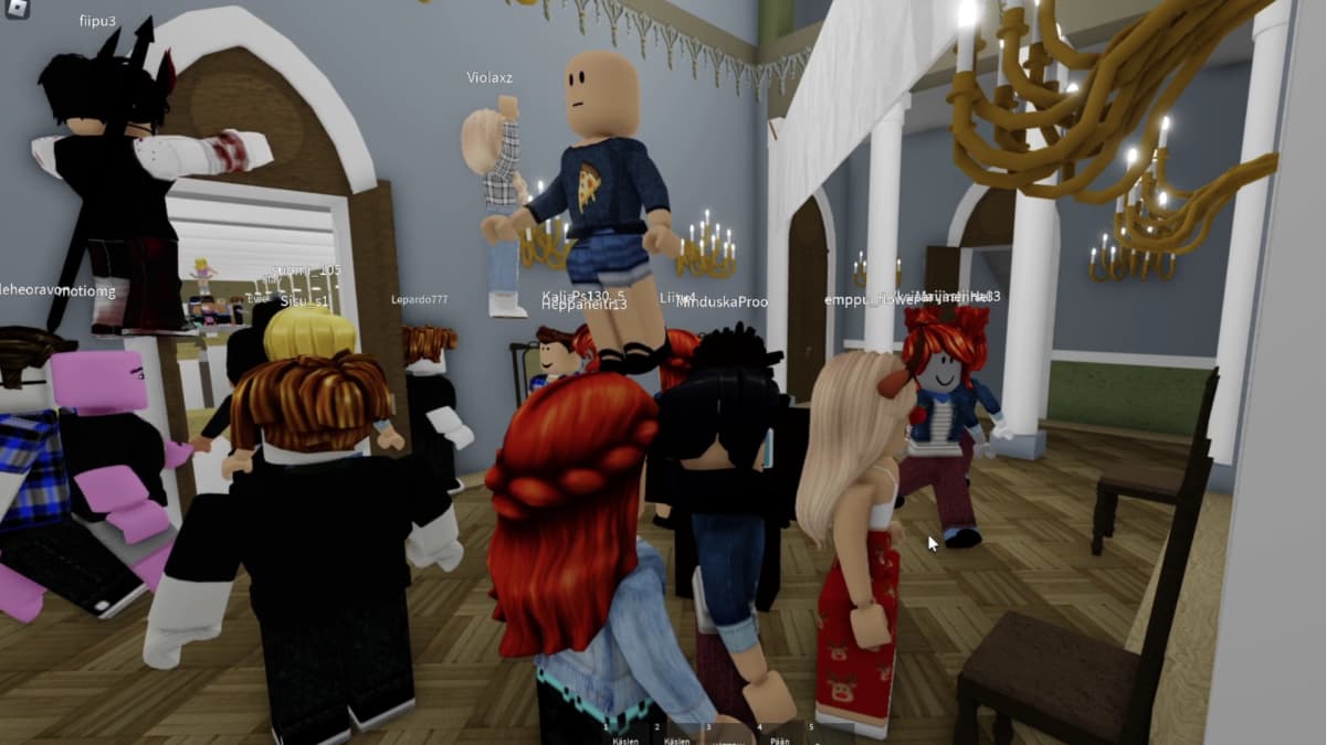 Roblox-pelimaailmassa kuutiolta näyttäviä hahmoja juhlimassa.