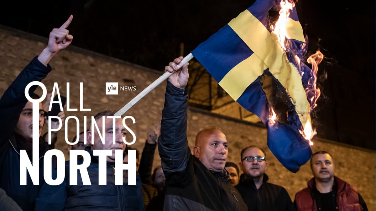 An image of protestors setting fire to the Swedish flag outside the Swedish consulate in Istanbul, Turkey.