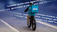 Composite image showing an e-bike courier with a large cubical blue backpack saying Wolt, seen from behind against a backdrop of contractual text.