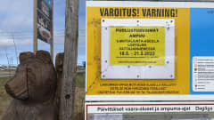 Kuvassa varoituskyltti ja puinen karhupatsas vieressä. 