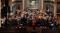 The Jyväskylä gospel choir members clapping their hands.