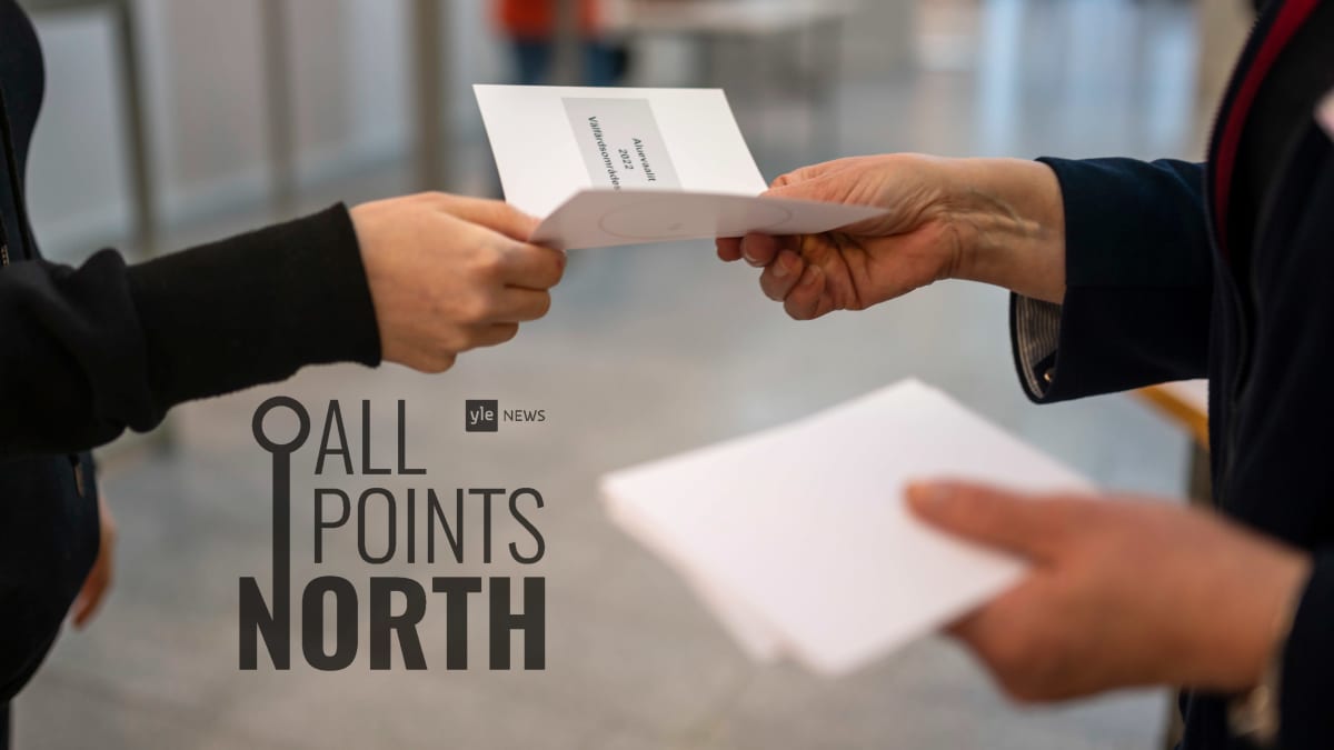 Photo of election official handing a voter a blank ballot, featuring the All Points North podcast logo.