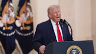 US President Donald Trump speaks about the Iran war from the Cross Hall of the White House in Washington.