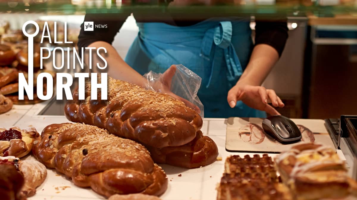 Photo of a bakery shop worker amid pastries and rolls, featuring the All Points North podcast logo.