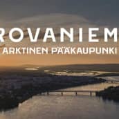 Rovaniemen kaupungin slogan, taustalla jätkänkynttiläsilta ja Kemijoki