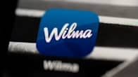 Wilman logo puhelinkaupassa.