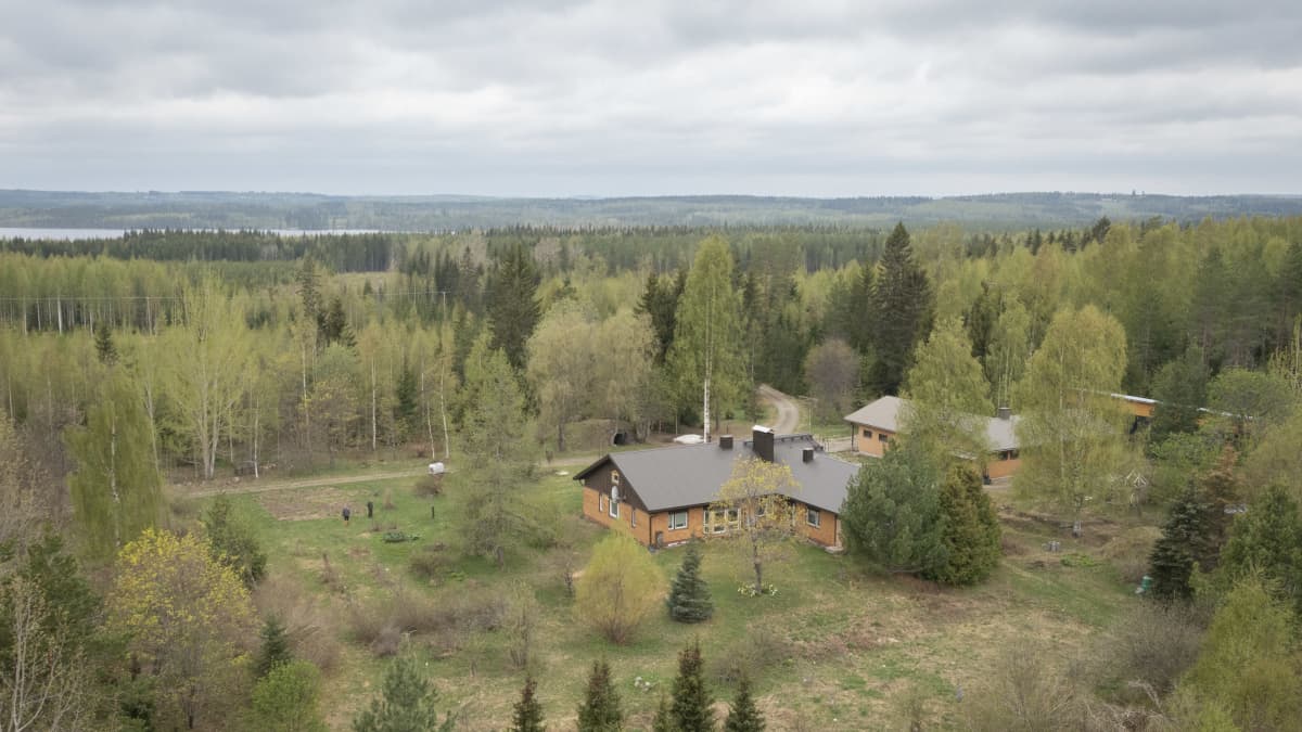 Aerial shot of a house in a rural area. 